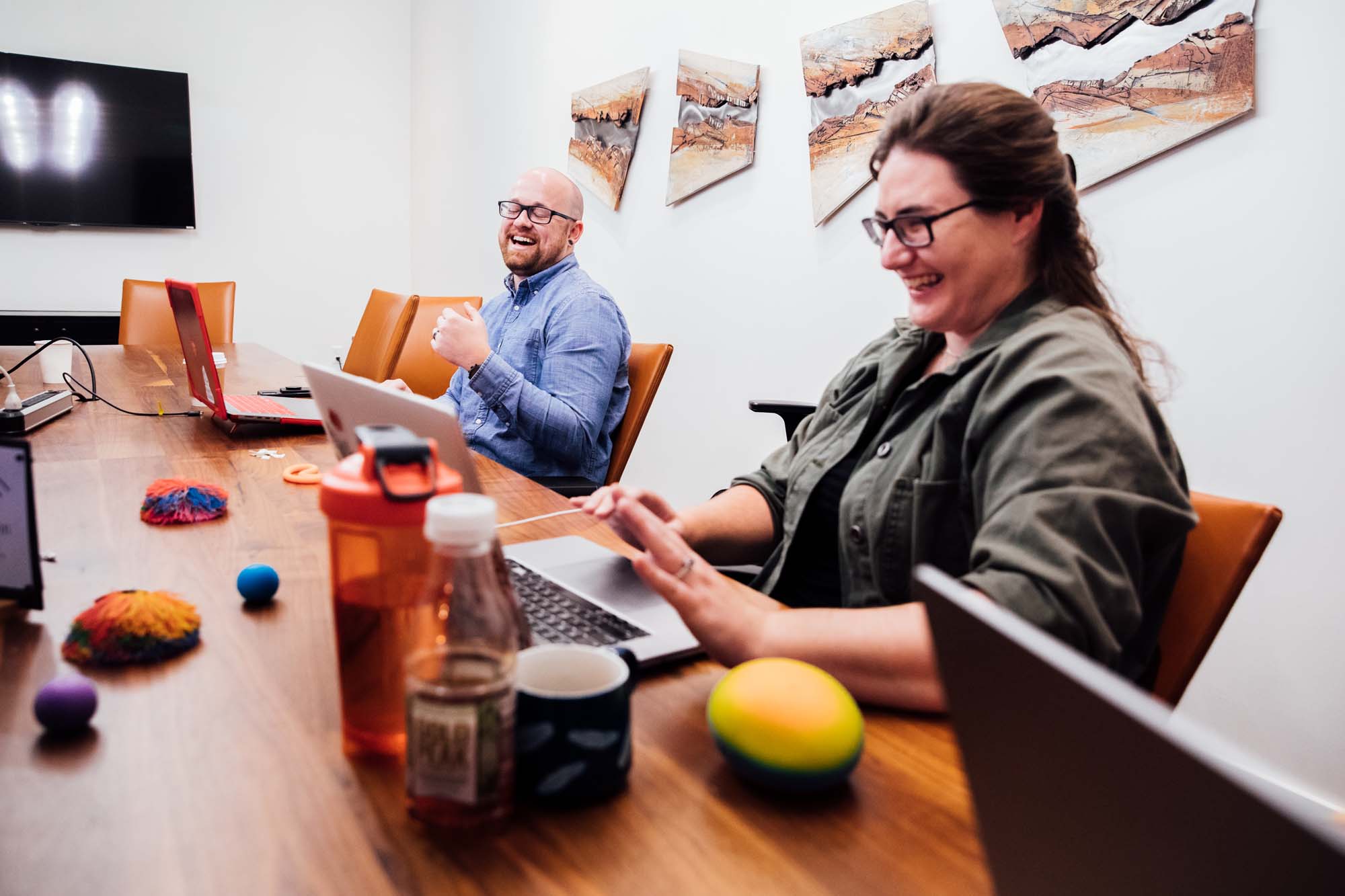Developers collaborating happily over websites